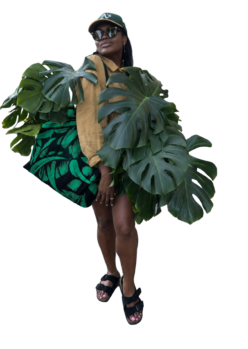 Tamara, The Plant Auntie, with monstera leaves